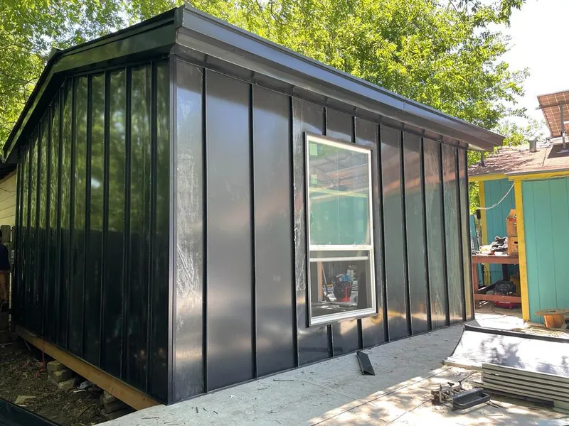 Black standing seam metal wall panels for Roof Inspection in Clovis