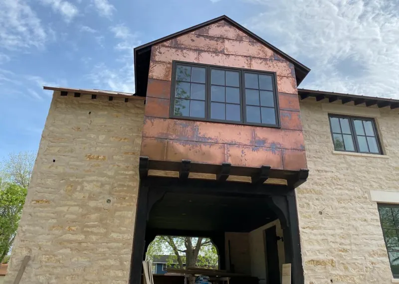 Copper metal panel facade on a stone building for Skylight Installation in Clovis