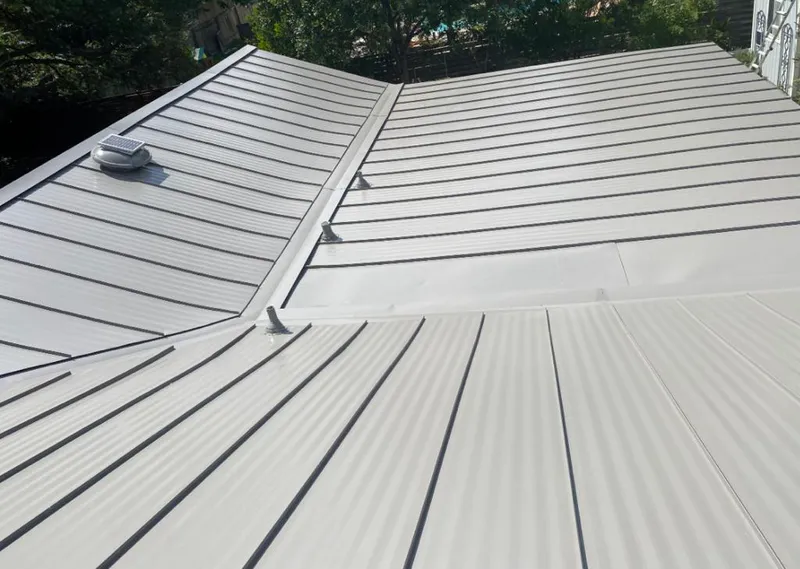 Solar attic fan installed on a metal roof for Roof Ventilation in Clovis